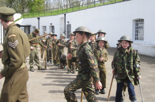 School children experience day visit Henley Fort in Guildford history activity WW2