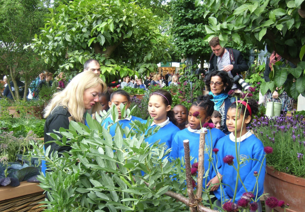 A picture of children working on Colette's secret garden as part of their outdoor learning programme in London