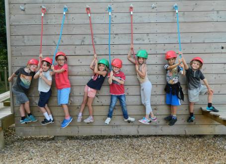 Children enjoying the challenge course at one of our summer camps in Surrey